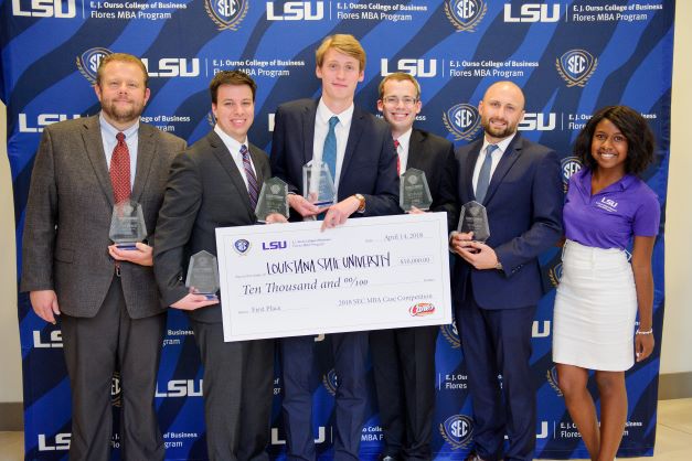 Group of students with competition trophy