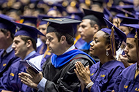 graduates at commencement