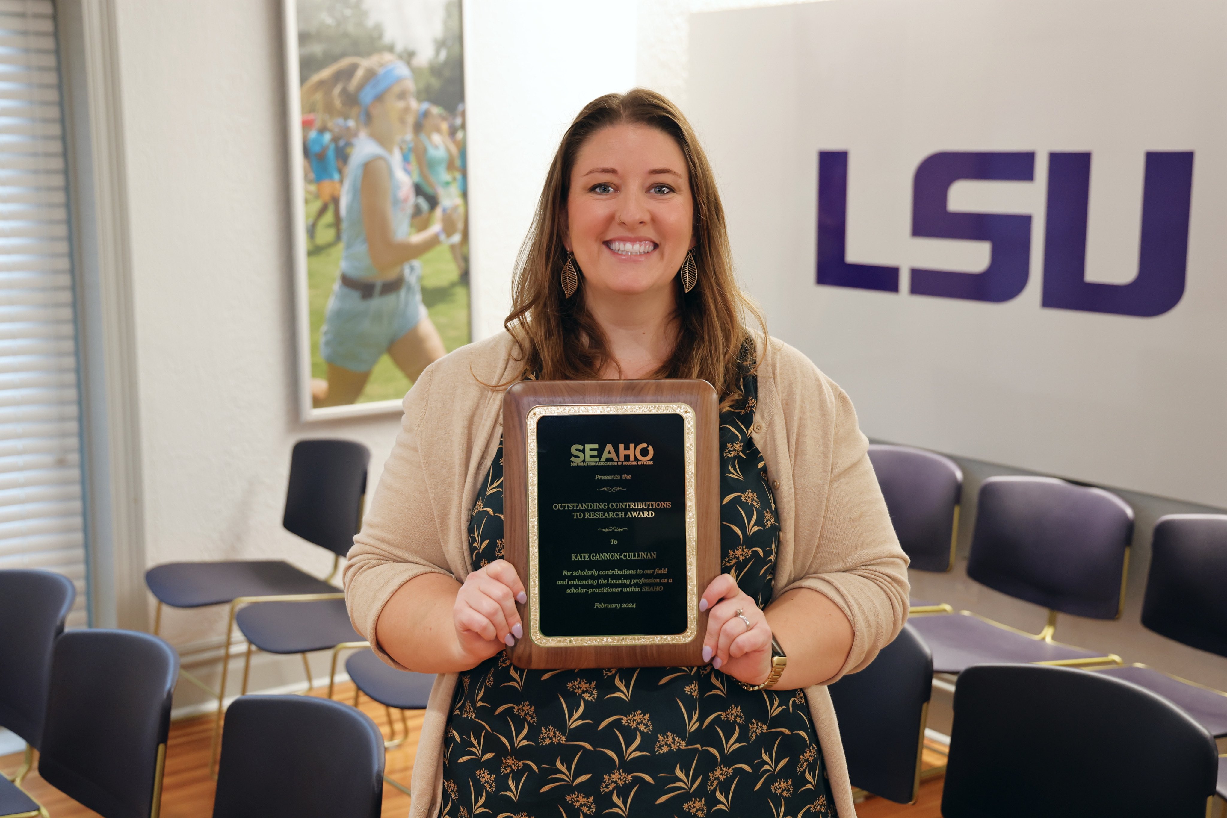 Kate Gannon-Cullinan posing with SEAHO Award