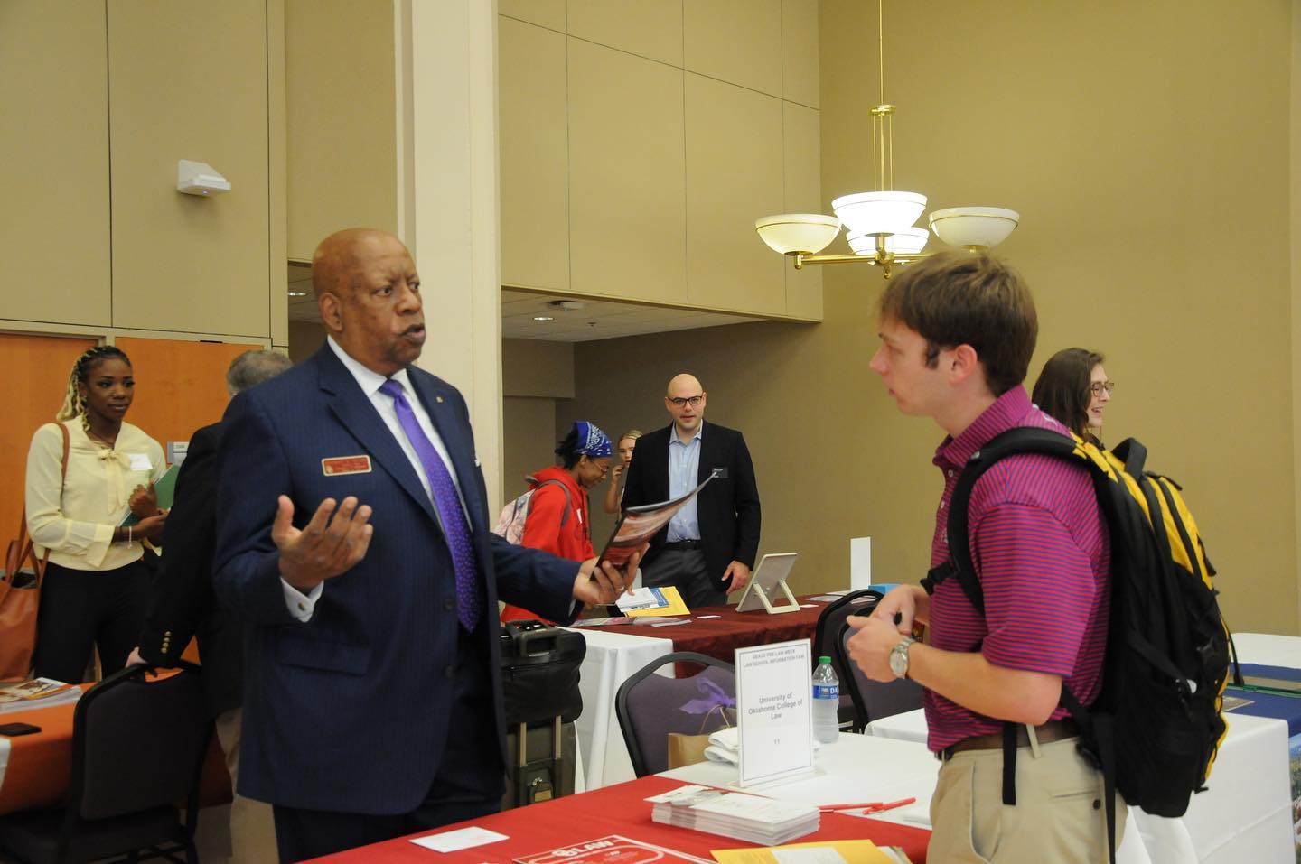 student speaking to representative at career fair