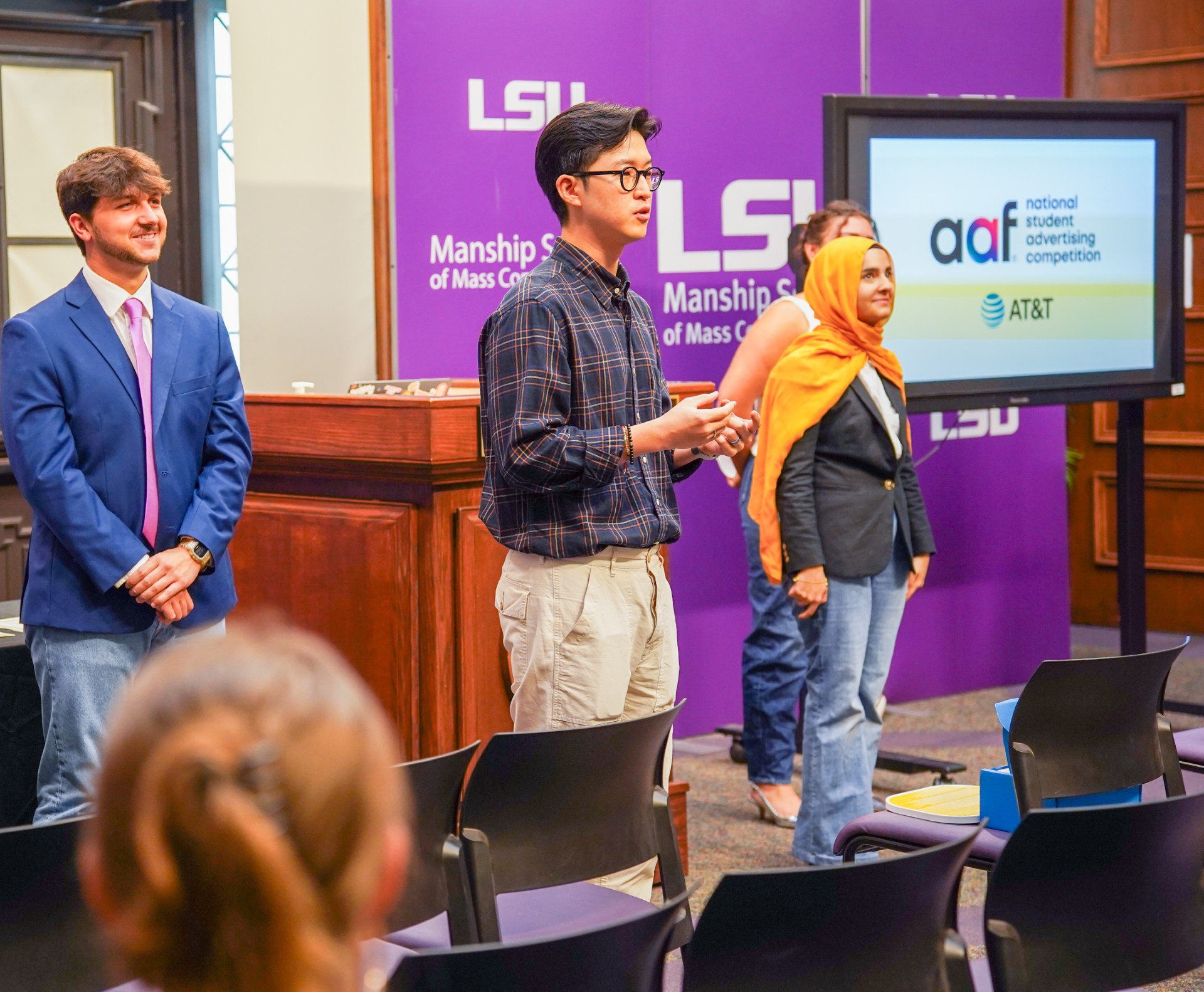 Digital advertising students and teacher presenting