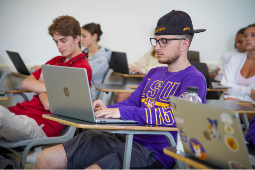 class of students on laptops